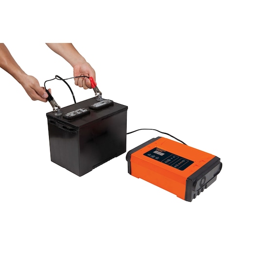 BLACKDECKER BC12 battery charger with digital display connected to black battery, white background, side angle