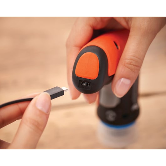 BLACKDECKER BCRTA601I cordless tool close-up showing USB charging port and cable.