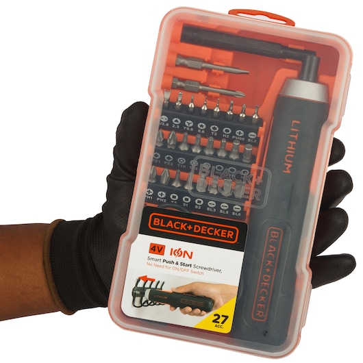 Photo of BLACK+DECKER BD40K27 electric screwdriver kit with bits in orange plastic case, held by gloved hand.