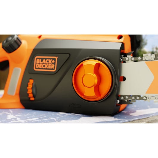BLACKDECKER BECS2040 chainsaw close-up showing orange tension knob, blade, and partial handle.