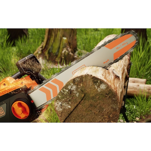 BLACKDECKER BECS2040 chainsaw cutting through a log outdoors, close-up of bar and chain in action.