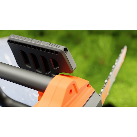Close-up of BLACK+DECKER BECS2040 chainsaw handle and guide bar in orange and black, outdoor background.