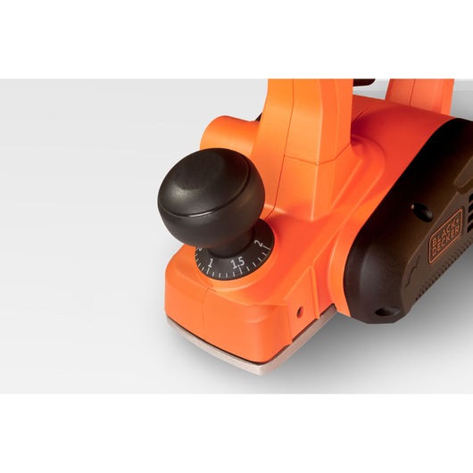 BLACK+DECKER BEW712 electric planer close-up, orange and black body, adjustable depth knob, front angle on white background.