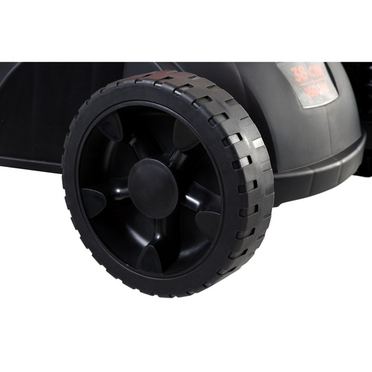 Photo of BLACKDECKER GR3800 black lawn mower wheel, close-up side angle, sturdy plastic tread and rim.
