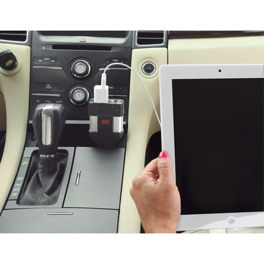 BLACKDECKER PI100LA power inverter charging a tablet in a car interior.
