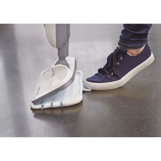 BLACKDECKER VL1300 steam mop with microfiber pad, close-up side angle on hard floor.