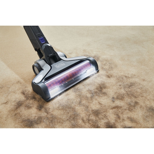 BLACKDECKER BSV20PET vacuum cleaner head on carpet with pet hair, front angle, product photography.